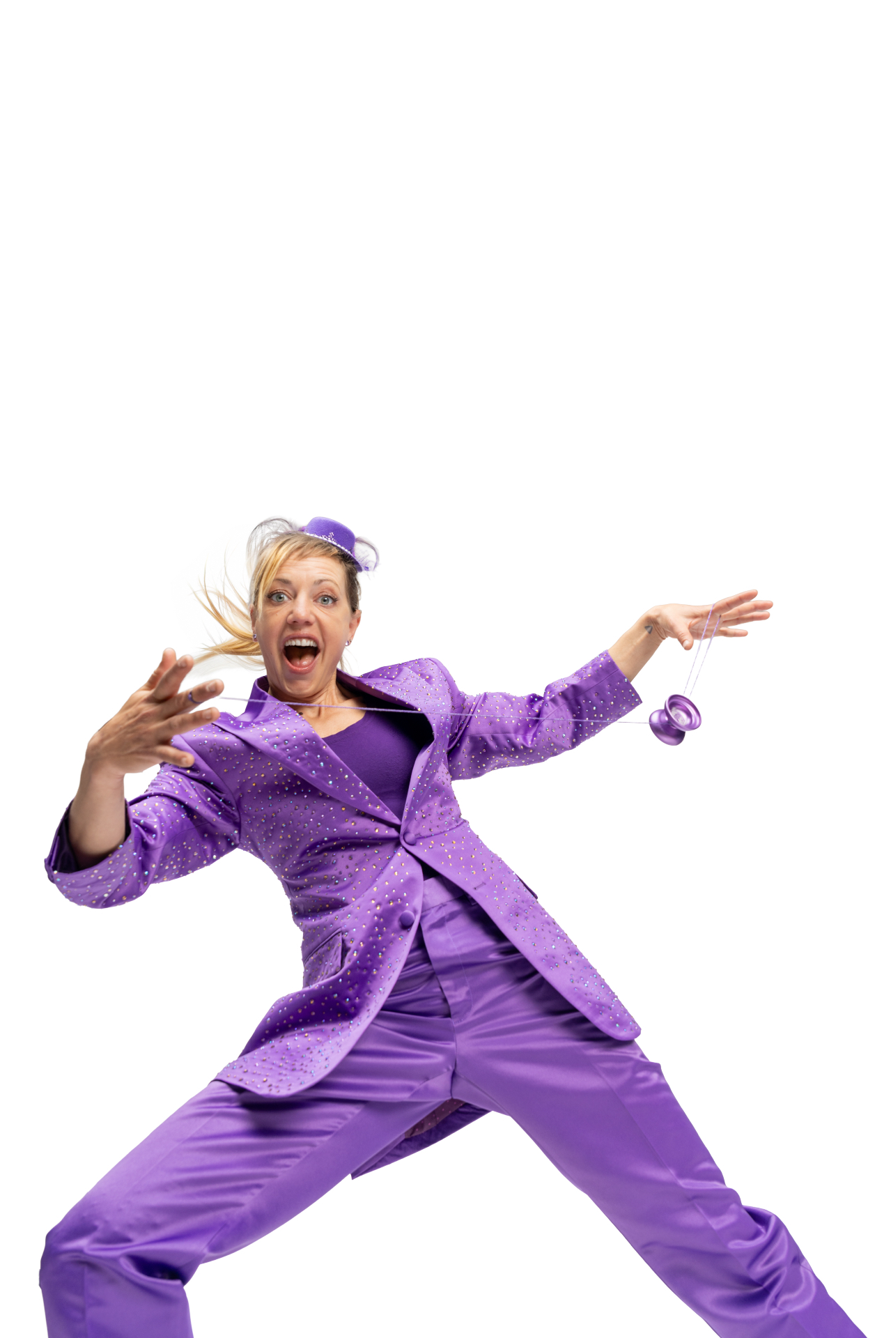 Jen Joy in a sparkling purple suit performing a yo-yo trick mid-leap